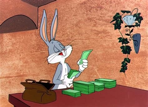 Bugs Bunny counts a stack of green cash on a table, with a brown bag beside him.